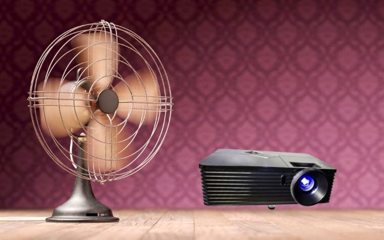 a cooling fan and a black projector