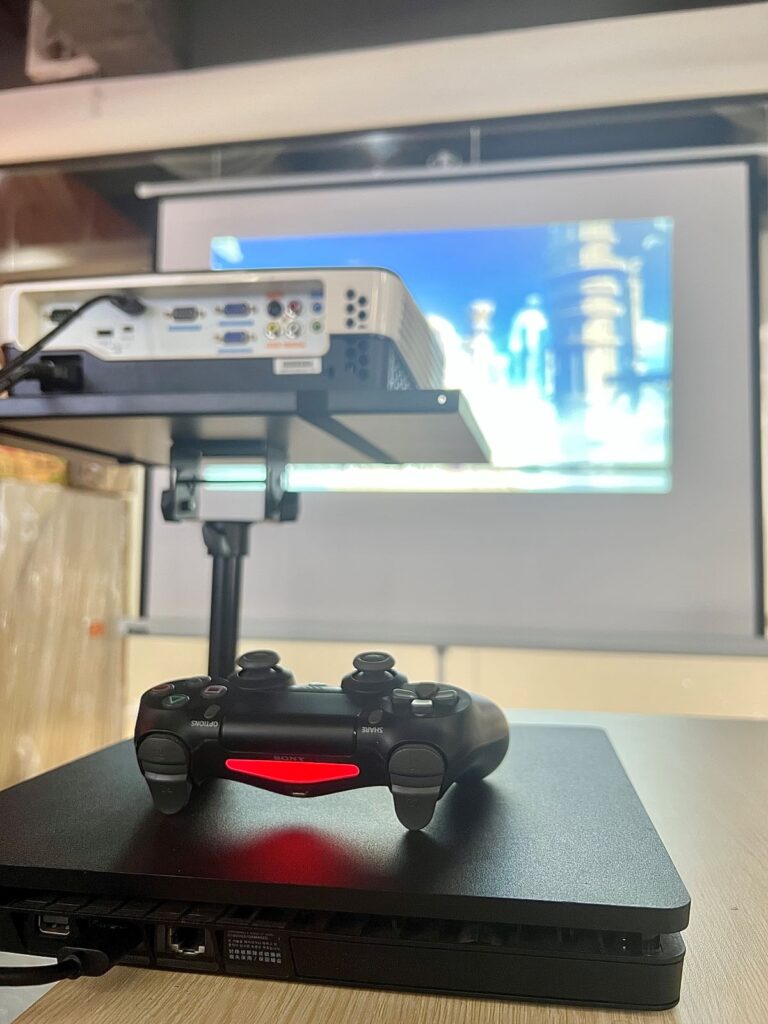a ps4 is connected to a benq projector