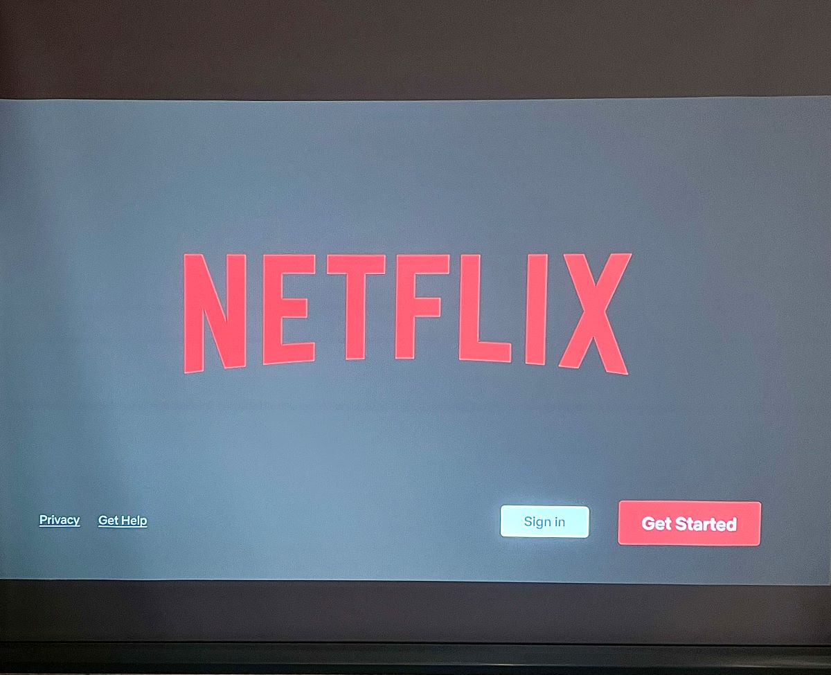 benq projector streaming a fire tv stick, showing netflix screen