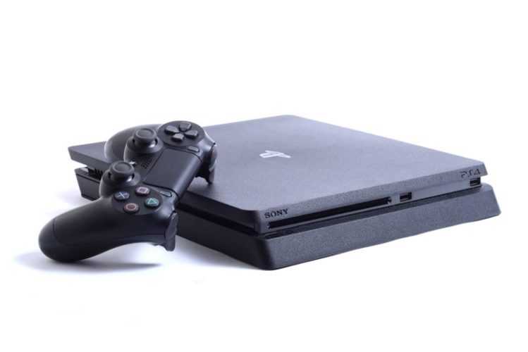 black PS4 Slim console and controller