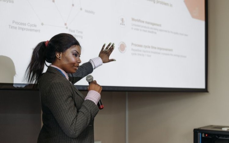 black woman using projector screen with border frame in her presentation