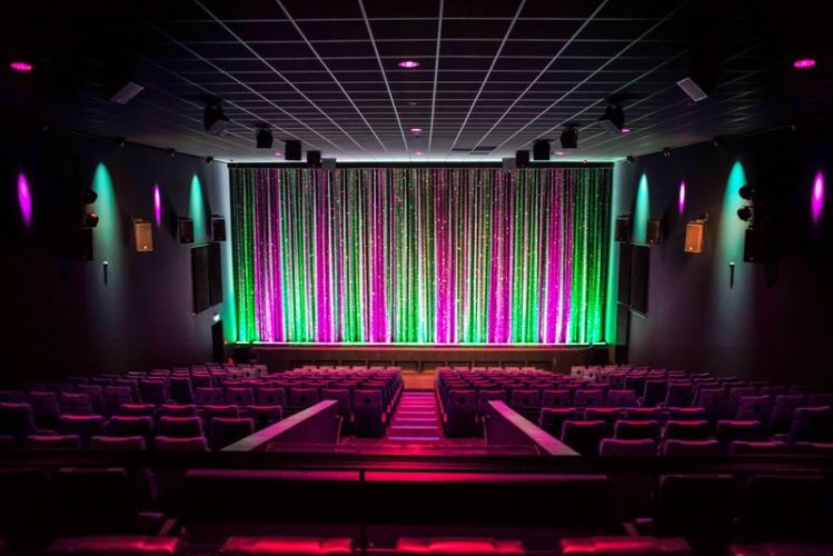 cinema room full of LED lights and Dolby Atmos
