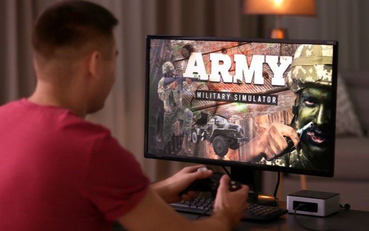 A man is gaming on an HDR display on his monitor