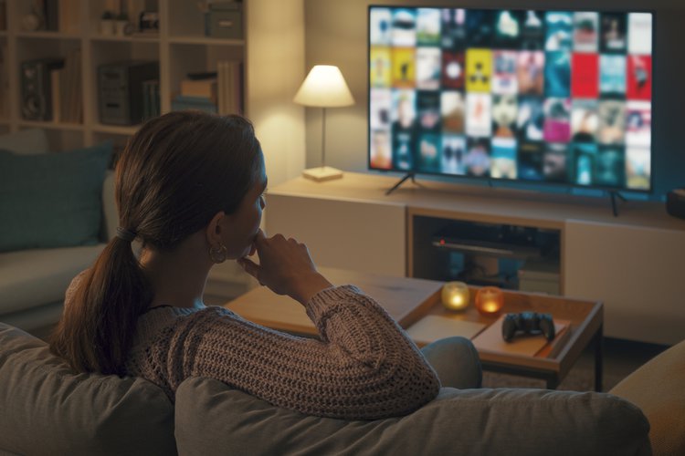 A woman using a smart TV