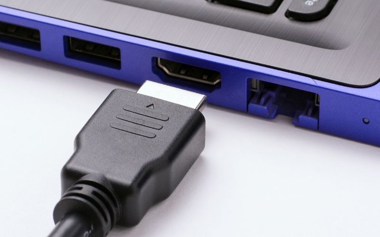 Plug an HDMI cable to a laptop