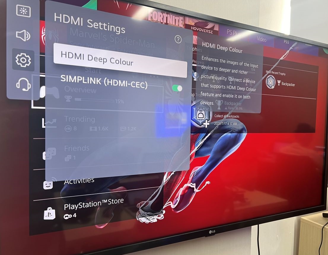 The HDMI deep color is being selected with the background of Spider-Man game