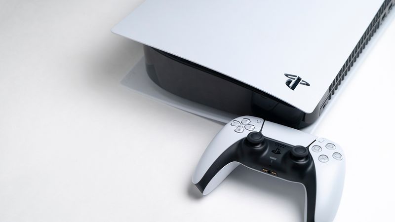 The PS5 console and controller on white background