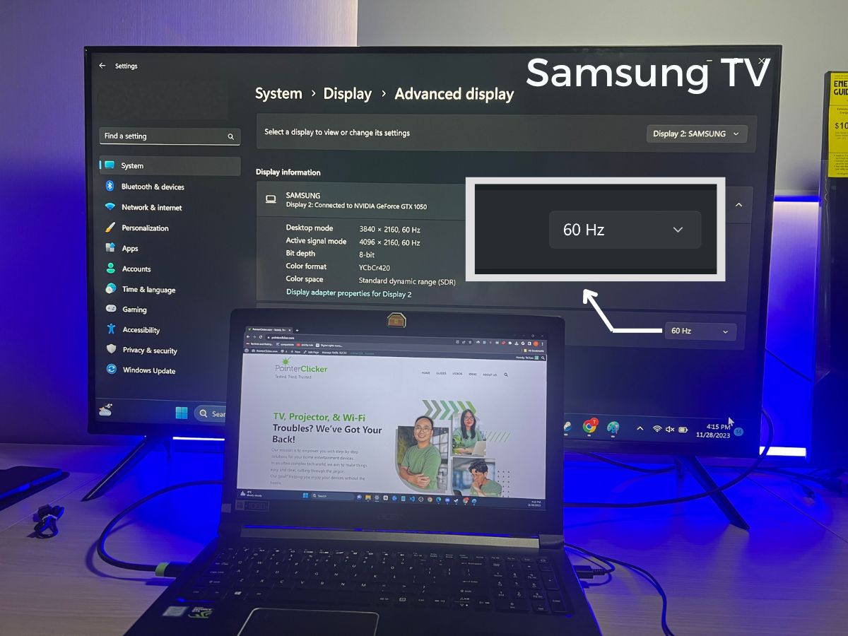 The advanced display on Windows showing the Samsung TV specifications with an Asus laptop is placed in the front