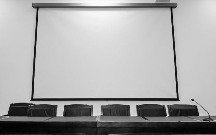 a big projector screen conference room
