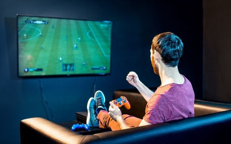 a man is playing a soccer game with bright and sharp images