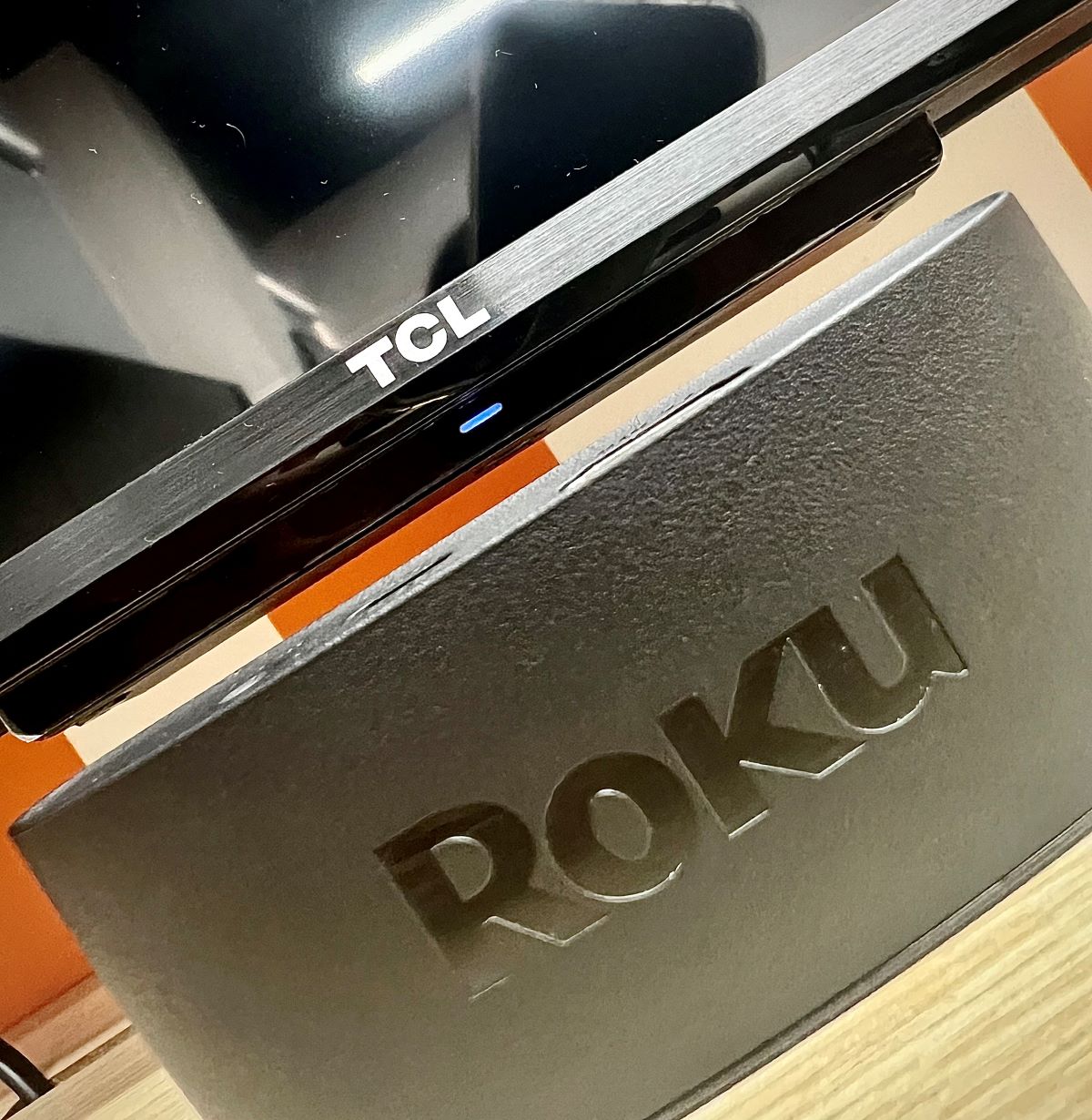 a roku express 4K+ right below a tcl tv