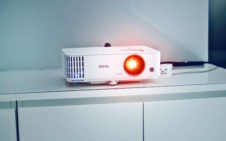 a white benq projector working