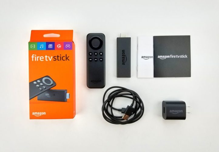 an Amazon fire stick, remote, power adapter and USB cable