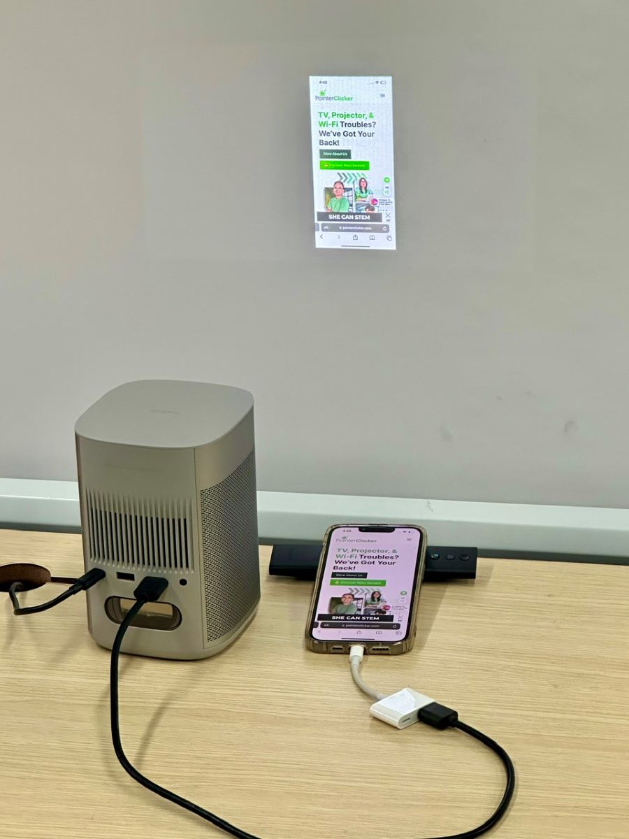 an iphone is connected to an xgimi projector using an hdmi adapter