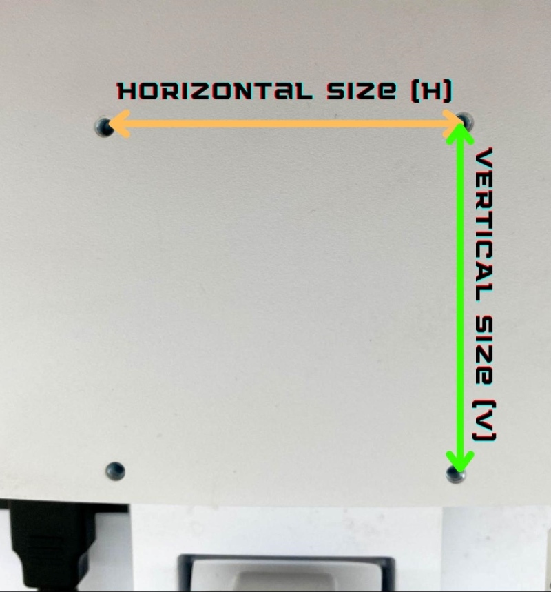 measuring the horizontal and vertical distances of mounting holes on the back of a monitor
