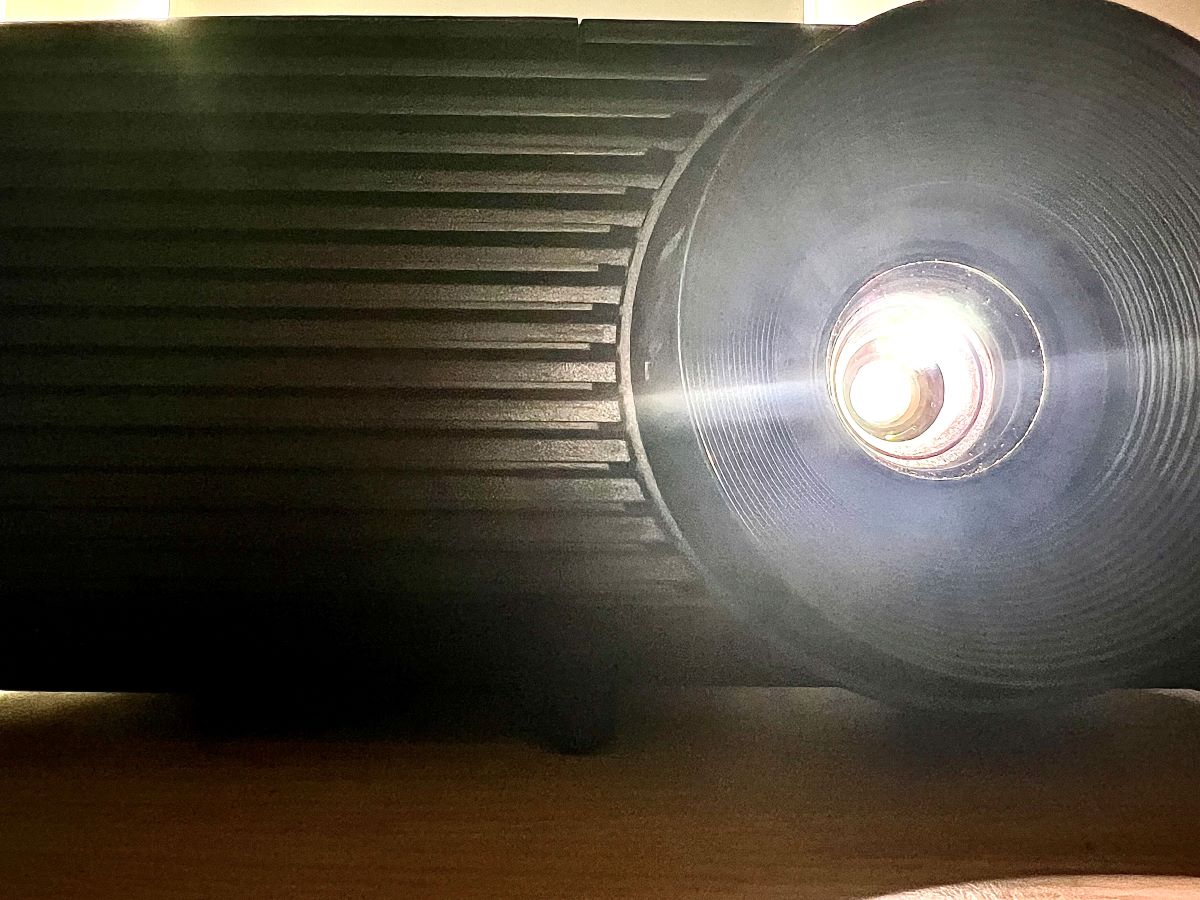 optoma projector looked from close front, lighting white