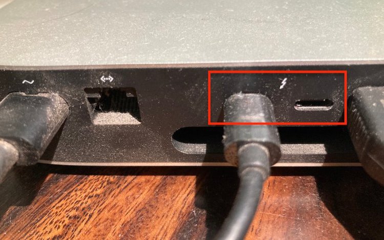 plug your USB-C cable into the port directly next to the Thunderbolt logo