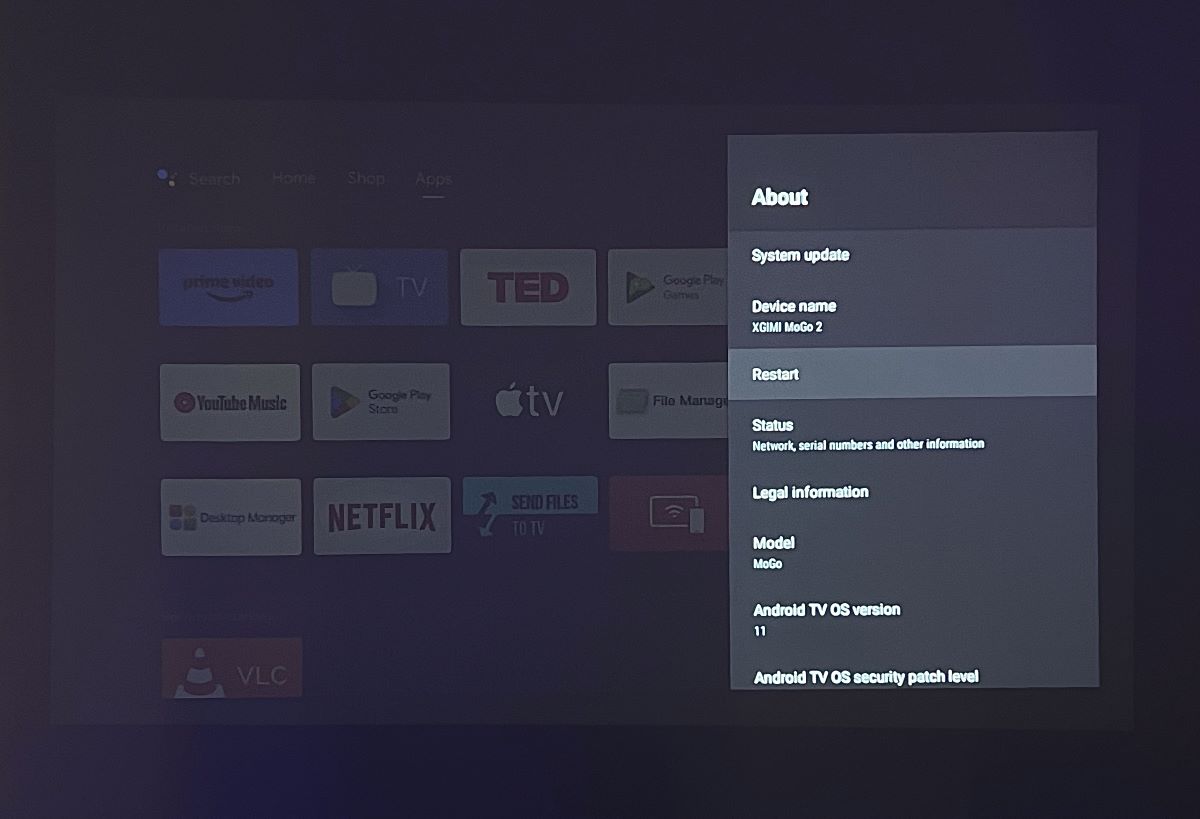 restart option in the settings menu is highlighted on an xgimi projector