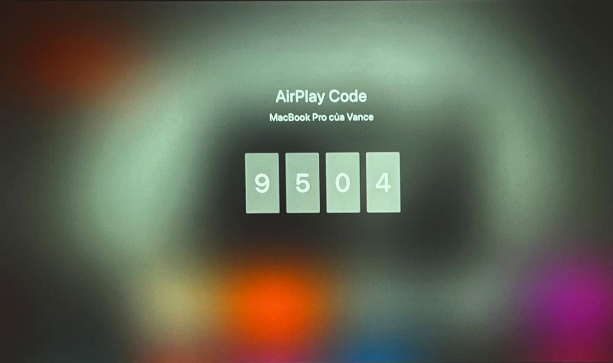 The AirPlay feature on Apple TV is showing 4-digit code on the projector screen