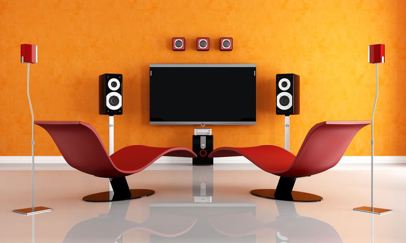 a modern home theater room painted in yellow