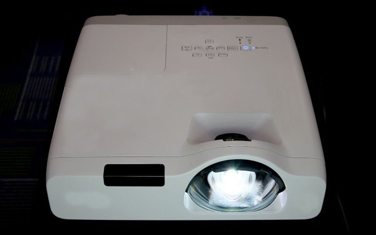 a white NEC projector lamp is working