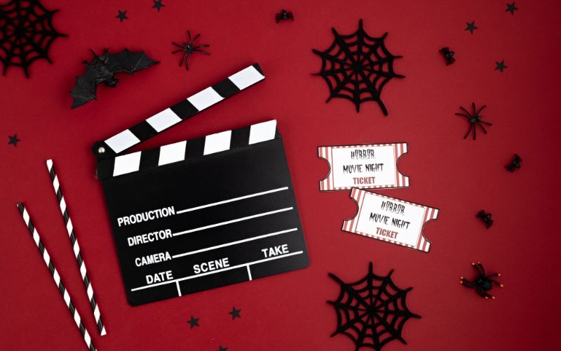 movie night ticket, movie symbol in a red, eerie background