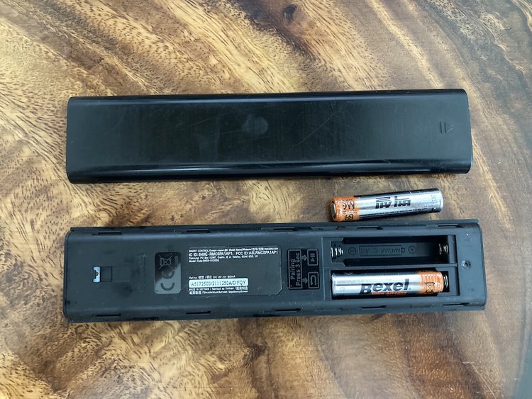 A Samsung TV remote with batteries