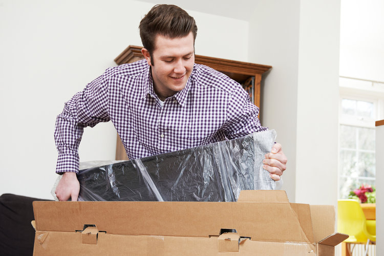 A man repack a TV