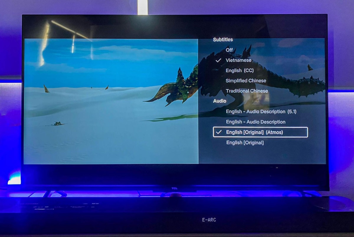 a TCL TV is showing a Netflix movie with Dolby Atmos audio format outputting to a soundbar