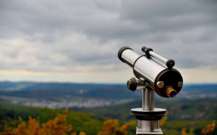 a white telescope in outdoor environment