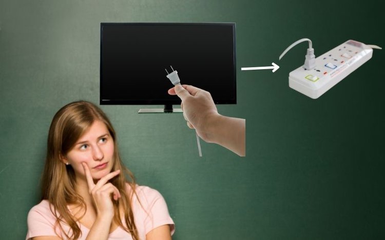 a woman thinking if TV cable can be plugged into a power strip