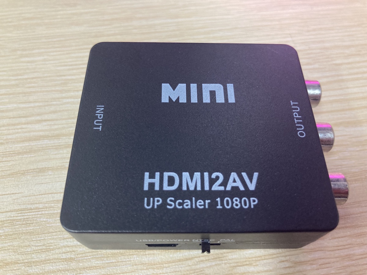 an HDMI to AV adapter on a table