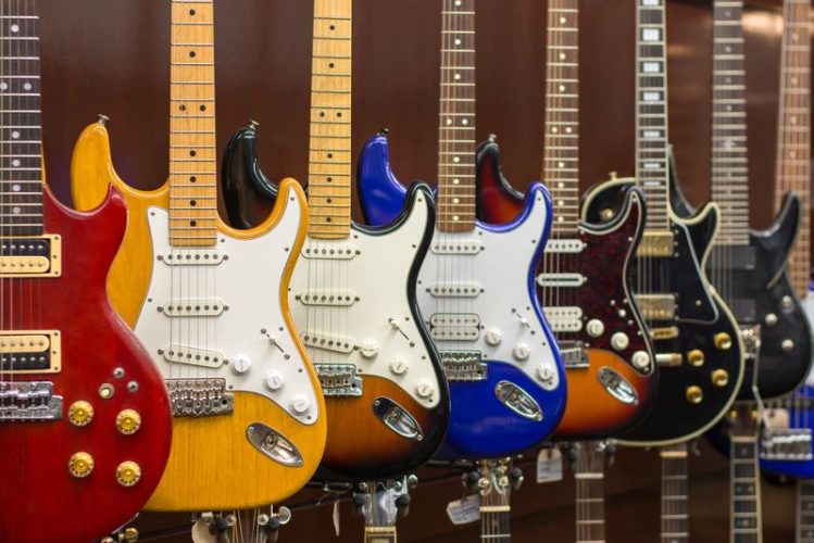 assortment of electric guitar in a pawn shop