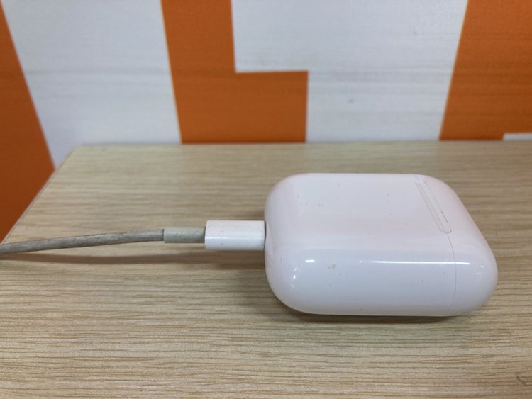 charging airpods on a table