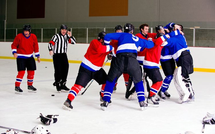 hockey players in a fight during a game