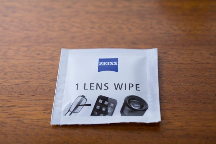 lens wipe from Zeiss on wooden floor