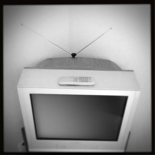 old TV with the antenna and remote