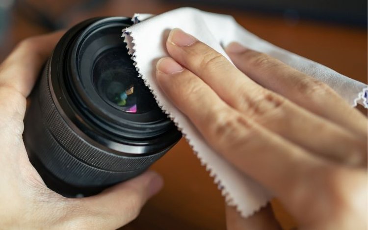 wipe camera lens with microfiber cloth