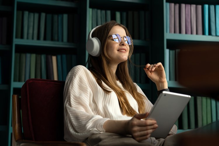 A woman enjoys audiobook
