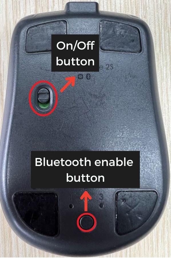 The Bluetooth button located under the wireless mouse