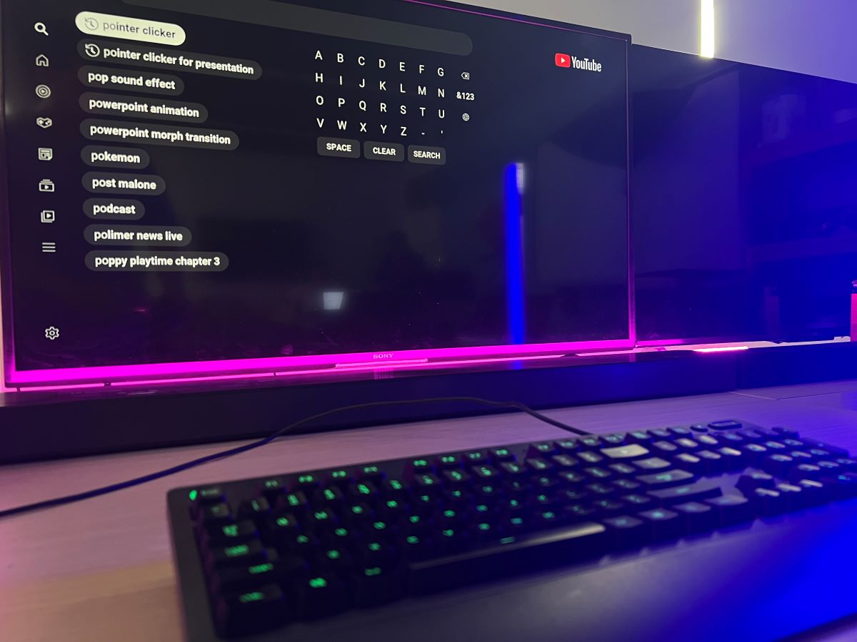 The keyboard is connected to the Sony TV with pink back light and a blue back light