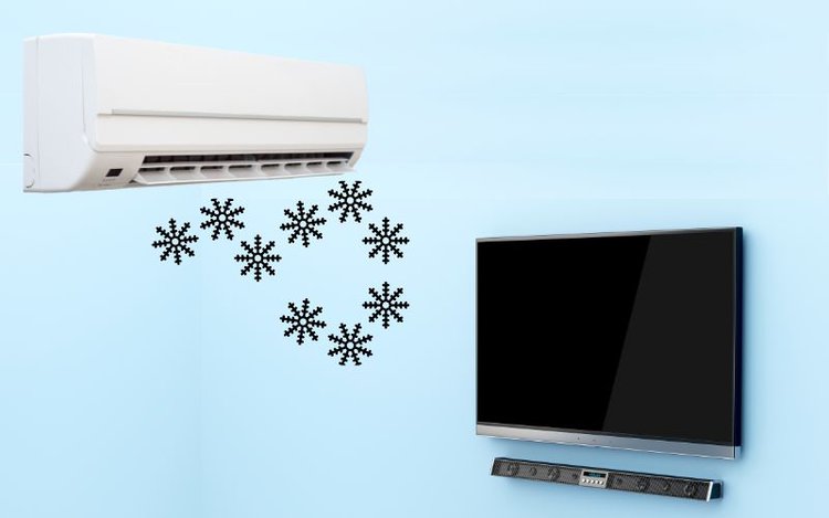 air conditioner is placed in front of a TV