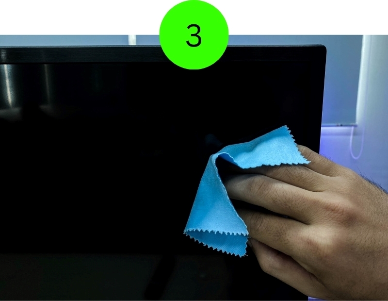 clean a TV screen with a wet microfiber cloth