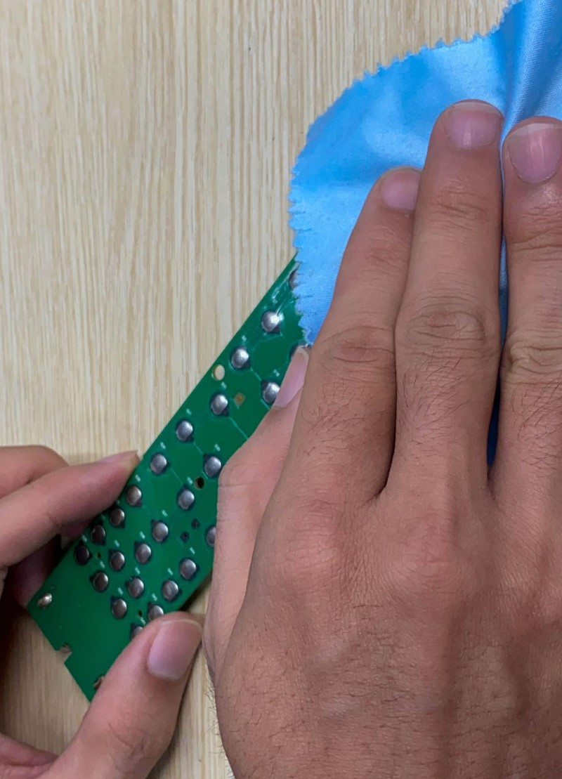 cleaning a TV remote control board