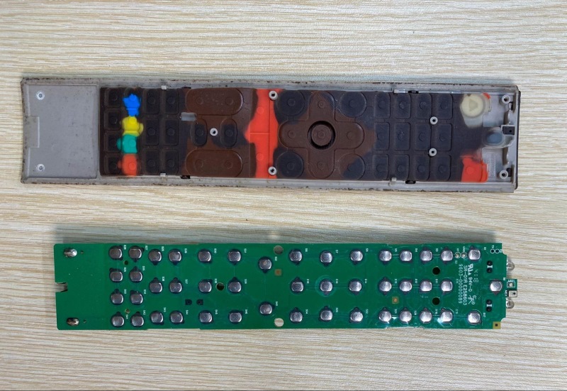 placing a TV remote control board next to a rubber panel