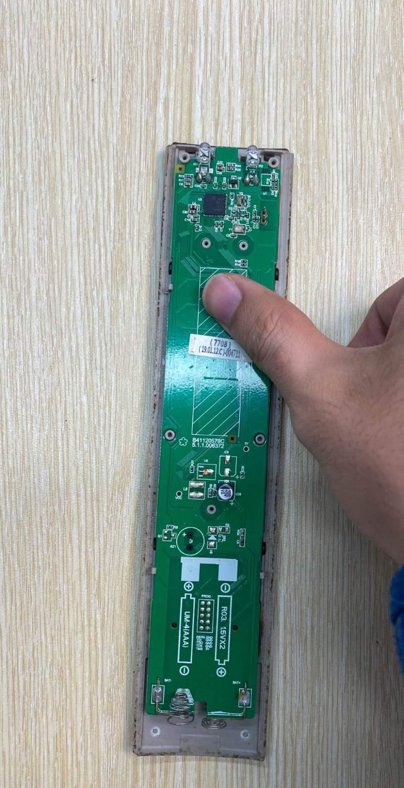 putting a TV remote control board into its plastic case