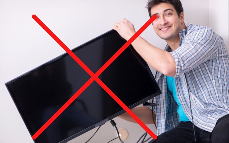 the wrong way of lifting a TV