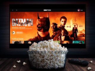 HBO Max Batman on TV screen behind a bowl of popcorn