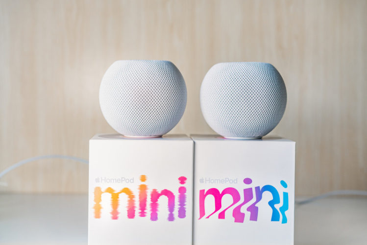 HomePod minis and their original boxes