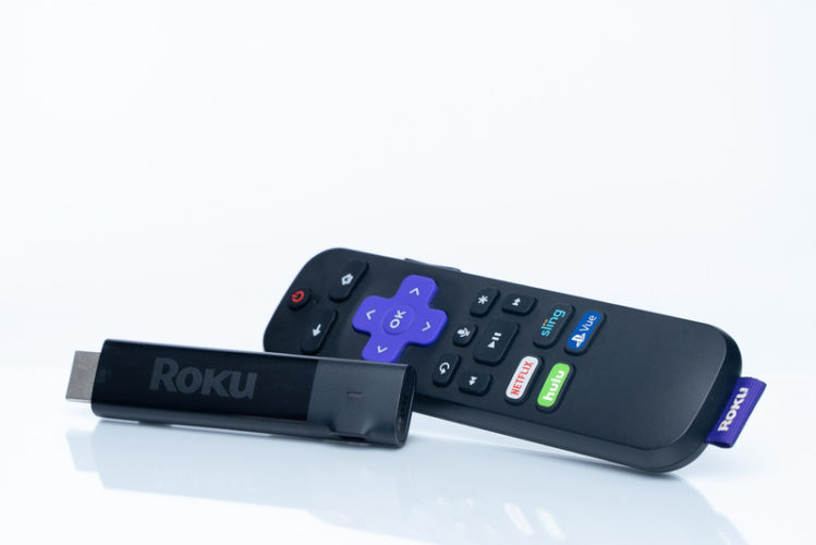a Roku stick and its remote control